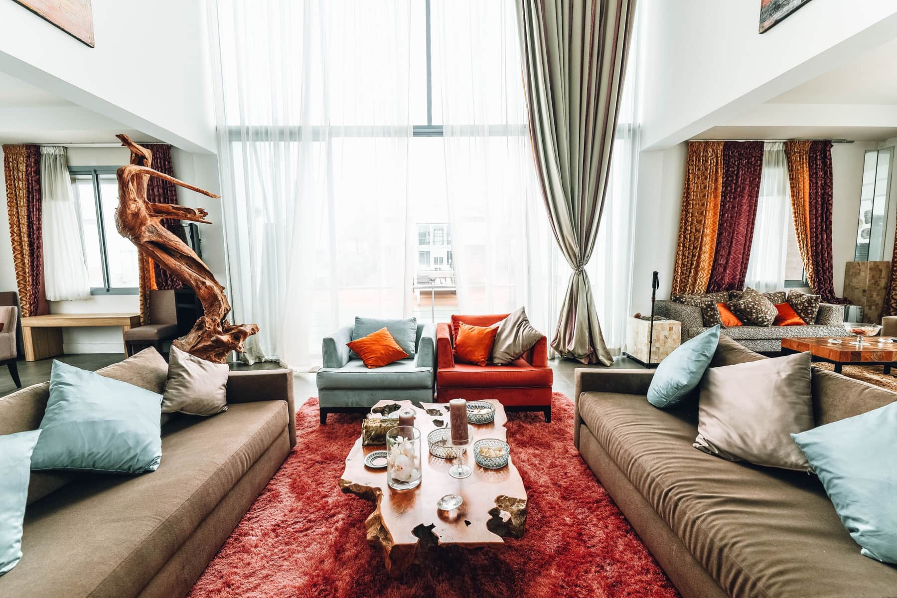 A large patterned area rug anchoring a furnished living room